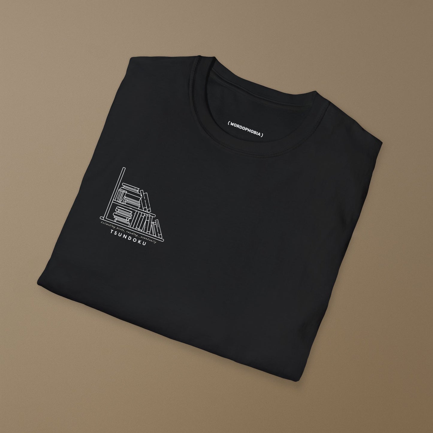Minimalist unisex folded t-shirt with the word “Tsundoku” in black cotton