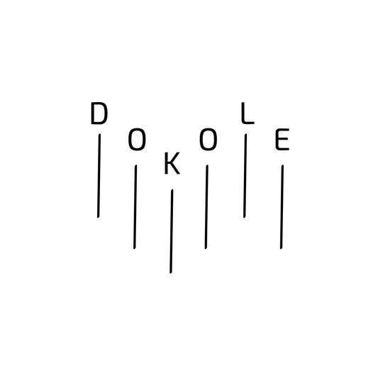 Enlarged design of minimalist t-shirt with the word “Dokole” in white cotton