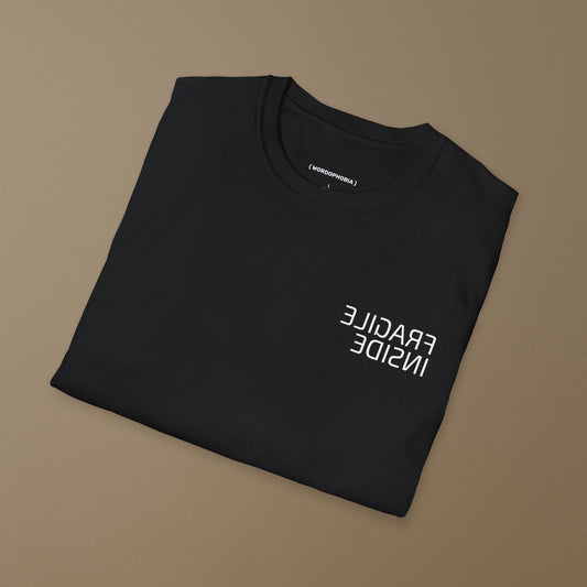 Minimalist folded t-shirt with phrase “Fragile Inside” in black cotton