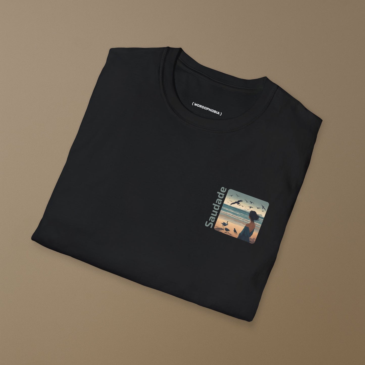Unisex folded cotton black t-shirt with the word “Saudade.”