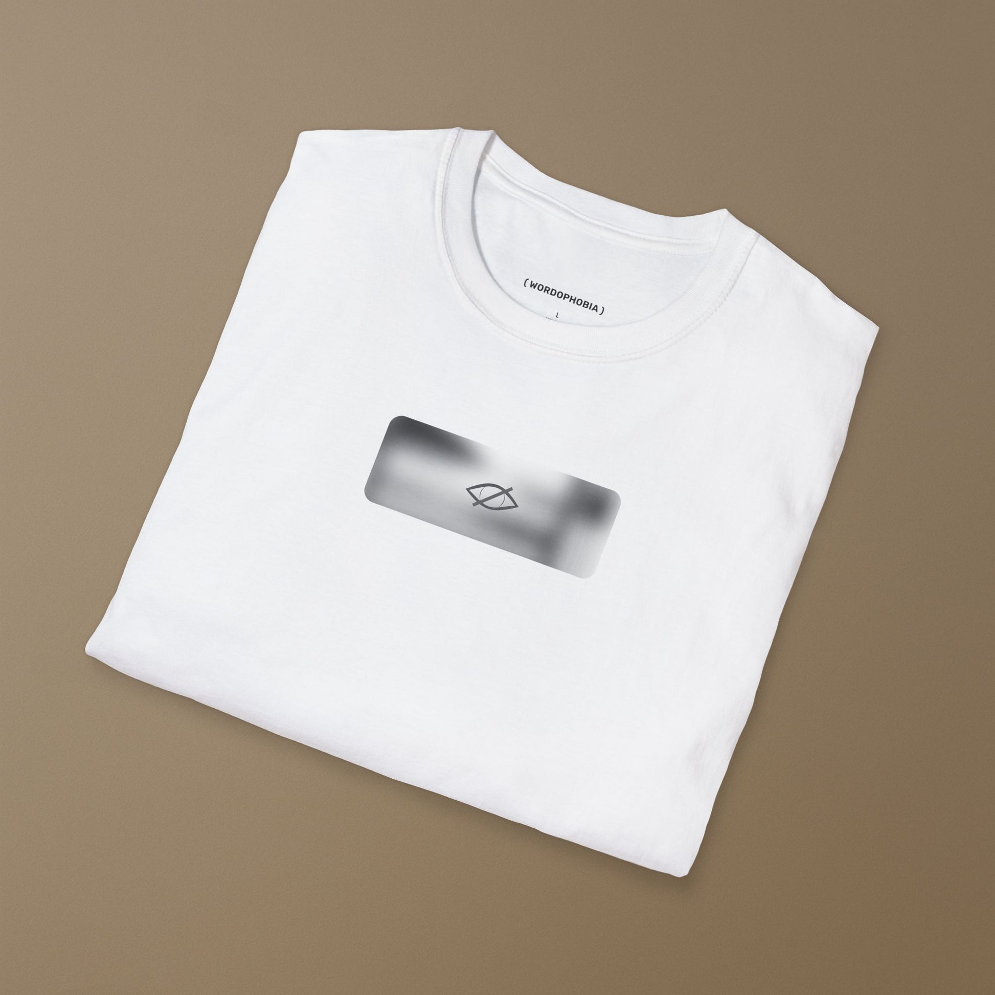 Folded white t-shirt with a a small blurred symbol "Sensitive content" on a beige background