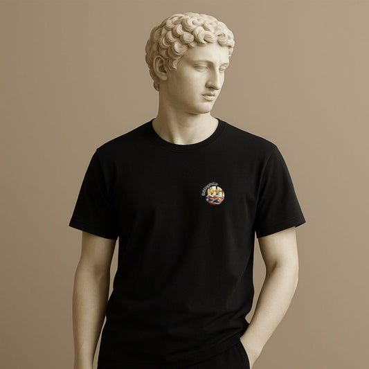 Roman statue in a back t-shirt with a colorful graphic design of a watercolor painting with pile of books and flowers near the window and text "Bibliophilia" against a beige background
