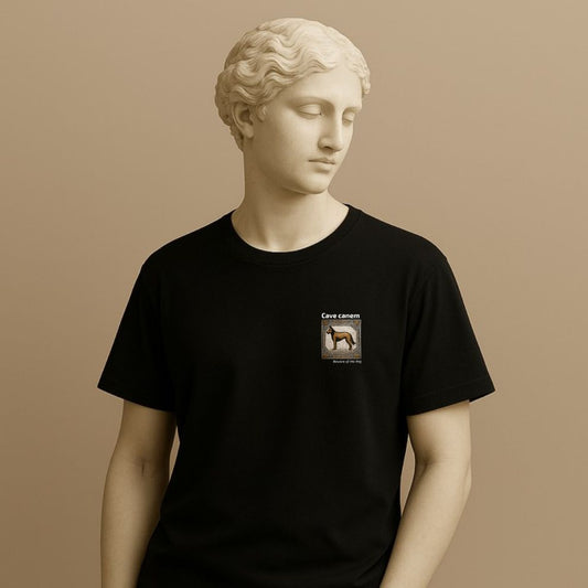 Statue wearing a black t-shirt with a small graphic of a tile with a dog illustration and 'Cave canem' (Beware of the dog) text on a beige background