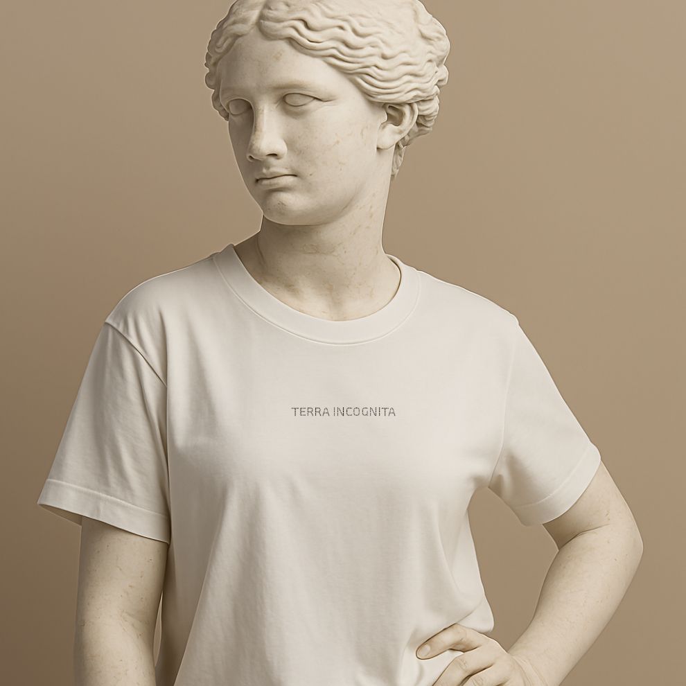Unisex minimalist t-shirt with the Latin phrase “Terra Incognita” in soft white cotton on the statue