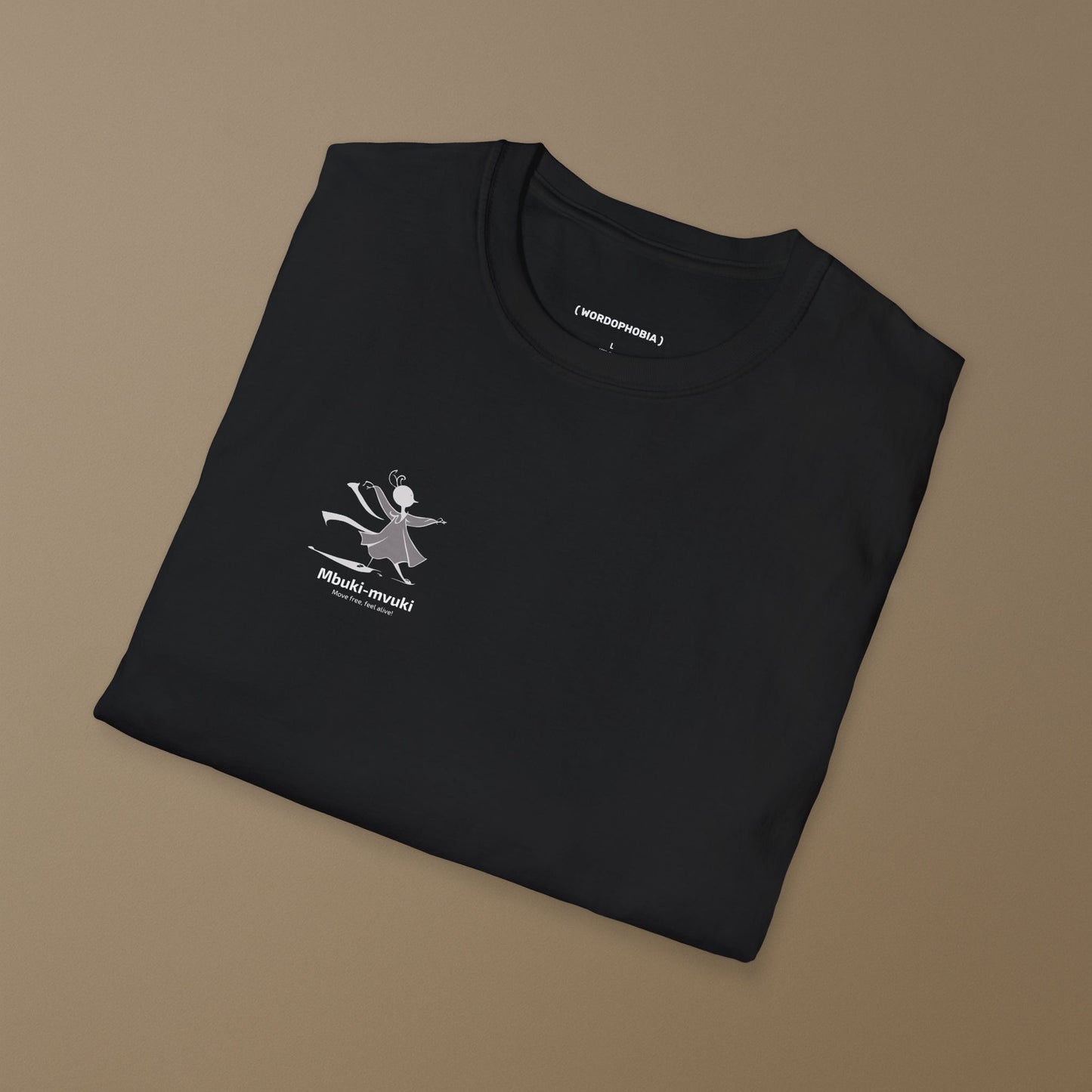 Folded black t-shirt with the African word Mbuki-mvuki and a tiny fantasy dancing mascot graphic on a brown background