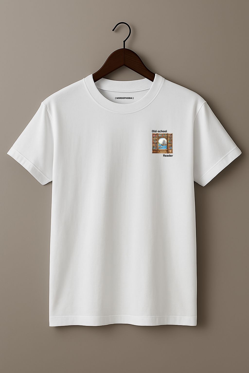Mock up of white t-shirt with a small graphic and text "Old-school reader" on a wooden hanger on a beige background