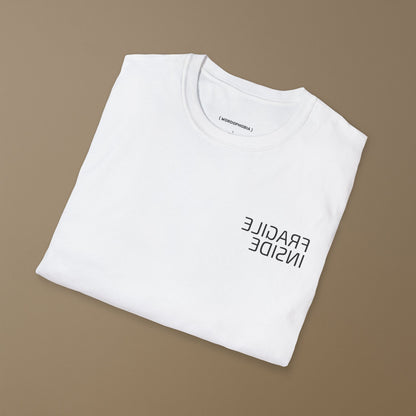 Minimalist folded t-shirt with phrase “Fragile Inside” in white cotton