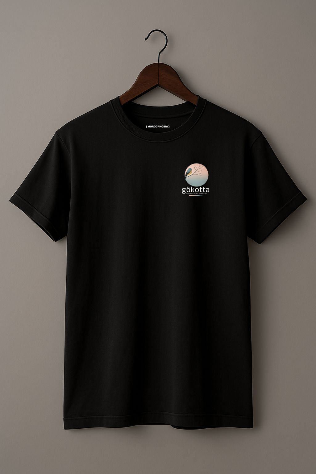 Mockup of minimalist t-shirt with Swedish word Gökotta in black cotton 