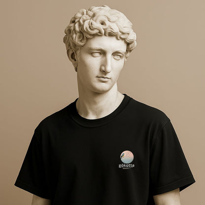 Minimalist t-shirt with Swedish word Gökotta in black cotton on the statue