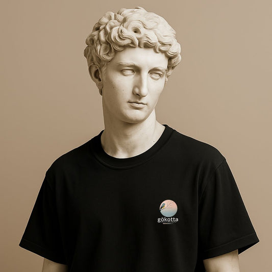 Minimalist t-shirt with Swedish word Gökotta in black cotton on the statue