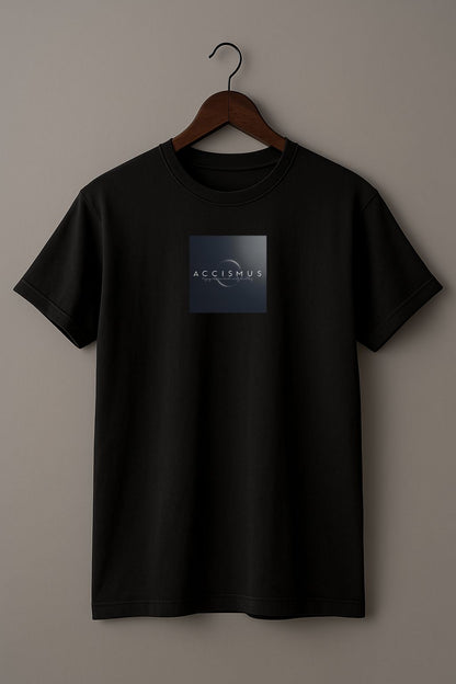 Black t-shirt with a design of the word “Accismus” and definition “Feigning indifference toward a secretly desired thing” on a hanger against a plain background