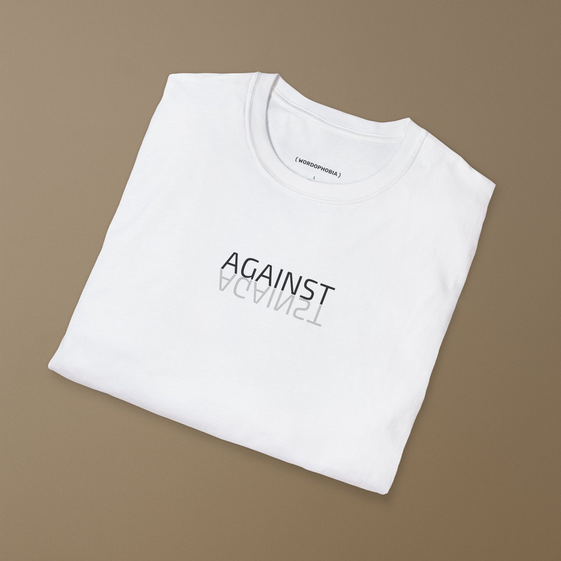 Folded white t-shirt with text on a brown background