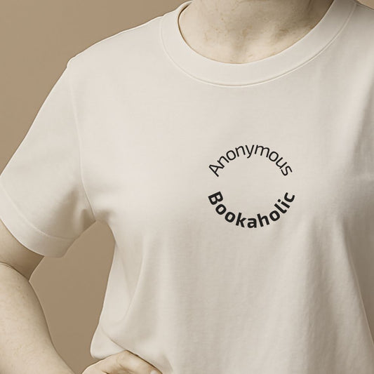 White t-shirt with 'Anonymous Bookaholic' text on a beige background on the statue