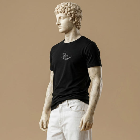 Statue wearing a black t-shirt with white phrase Bon Vivant, symbolizing joy, taste, and love of life, and small gentleman icon behind it  on a beige background