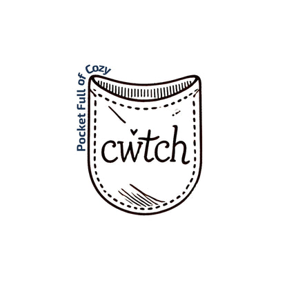 A tiny pocket with 'cwtch' word and text "Pocket Full of Cozy" on a white background. Enlarged design for a minimalist T-shirt