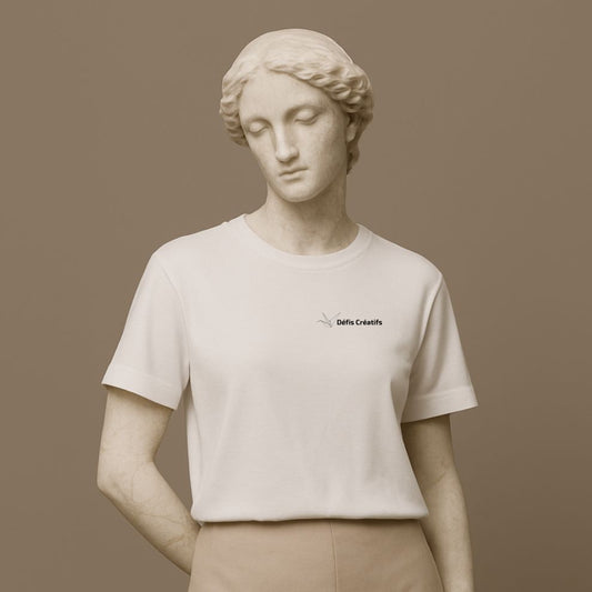 Statue wearing a white t-shirt with a small graphic design and text Defis Creatifs on a brown background