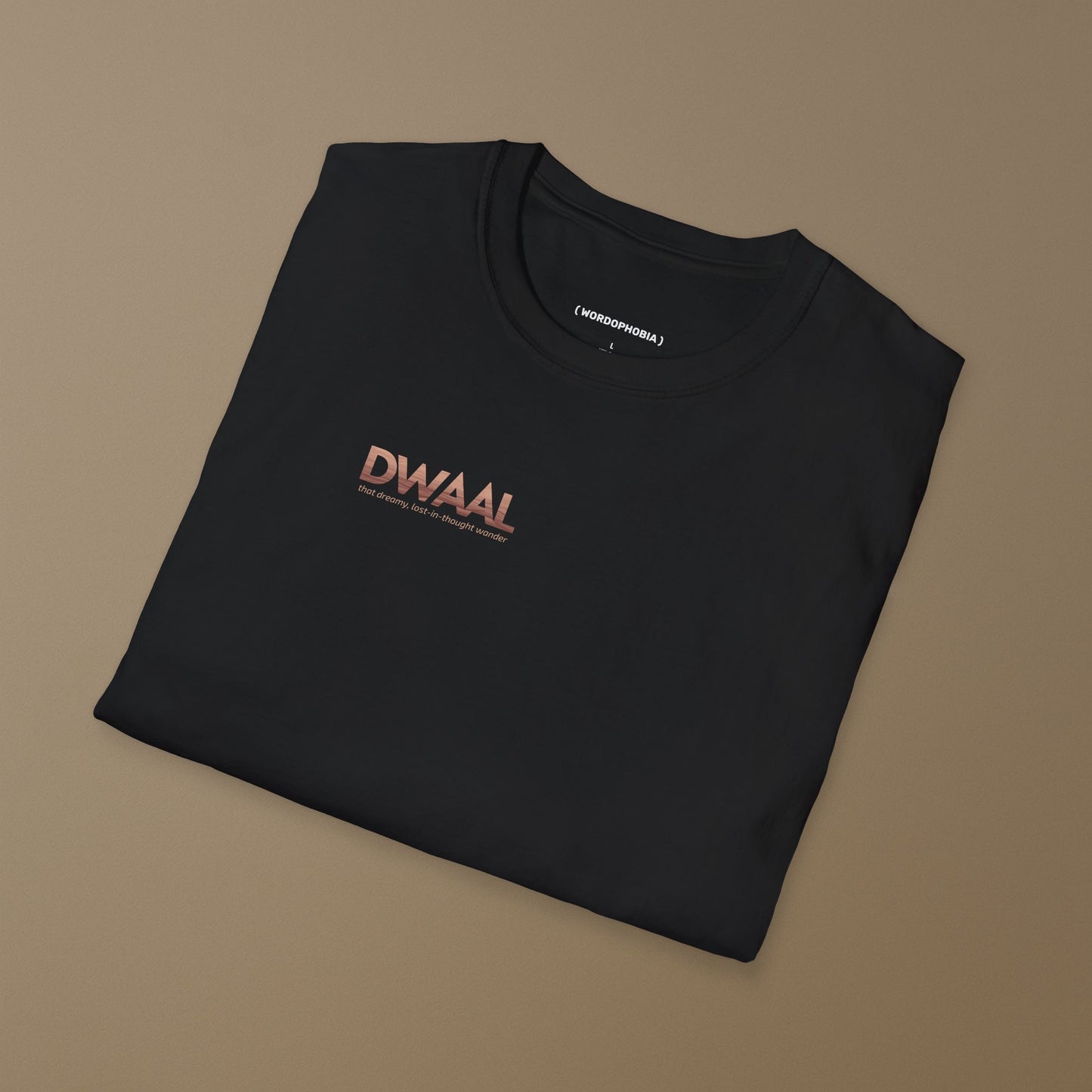 Folded black T-shirt with a logo "Dwaal"  on a brown background
