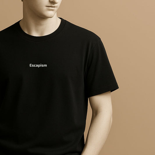 Statue wearing a black t-shirt with 'Escapism' text on a beige background