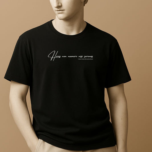 Statue in a black t-shirt with white latin phrase "Horas non numero nisi serenas" on a beige background