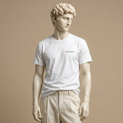 Statue wearing a white t-shirt with typographic design of the phrase “Koi no yokan,” a Japanese expression describing the feeling that love is destined to happen, and small heart on a beige background
