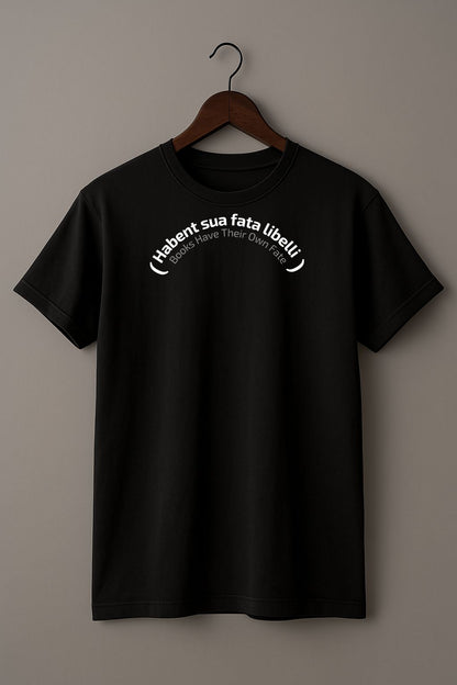 Black t-shirt with Latin phrase 'Habent sua fata libelli' and its translation "Books Have Their Own Fate"  on a wooden hanger against a plain background