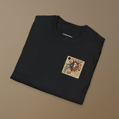 Folded black t-shirt with a graphic design with sun-like symbol and text 'Sol lucet omnibus' (The sun shones for all)  on a beige background