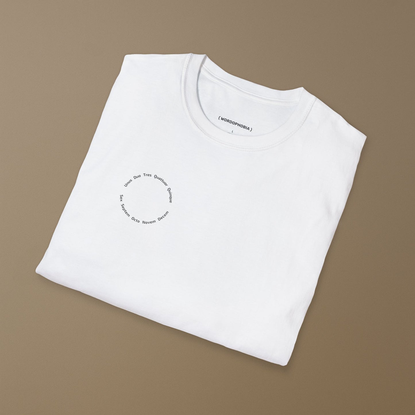 Folded white t-shirt with a small graphic with a circular arrangement of Latin numerals from 'Unus' to 'Decem' on a beige background