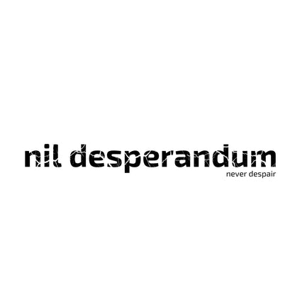 The Latin phrase “Nil Desperandum,” meaning “Never Despair,” printed in cracked typeface. Enlarged design for a minimalist T-shirt