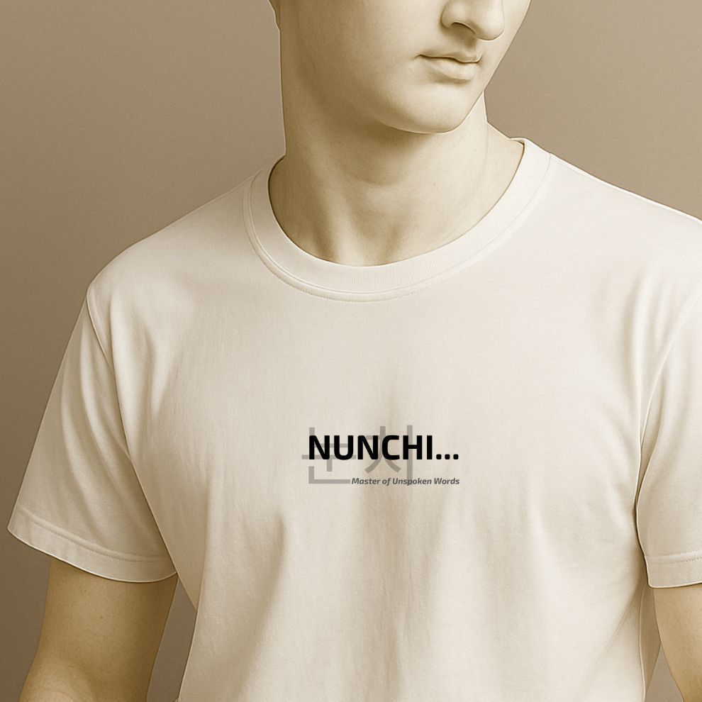 A statue wearing a white t-shirt with a text " 'NUNCHI' (Master of Unspoken Words)" on a beige background