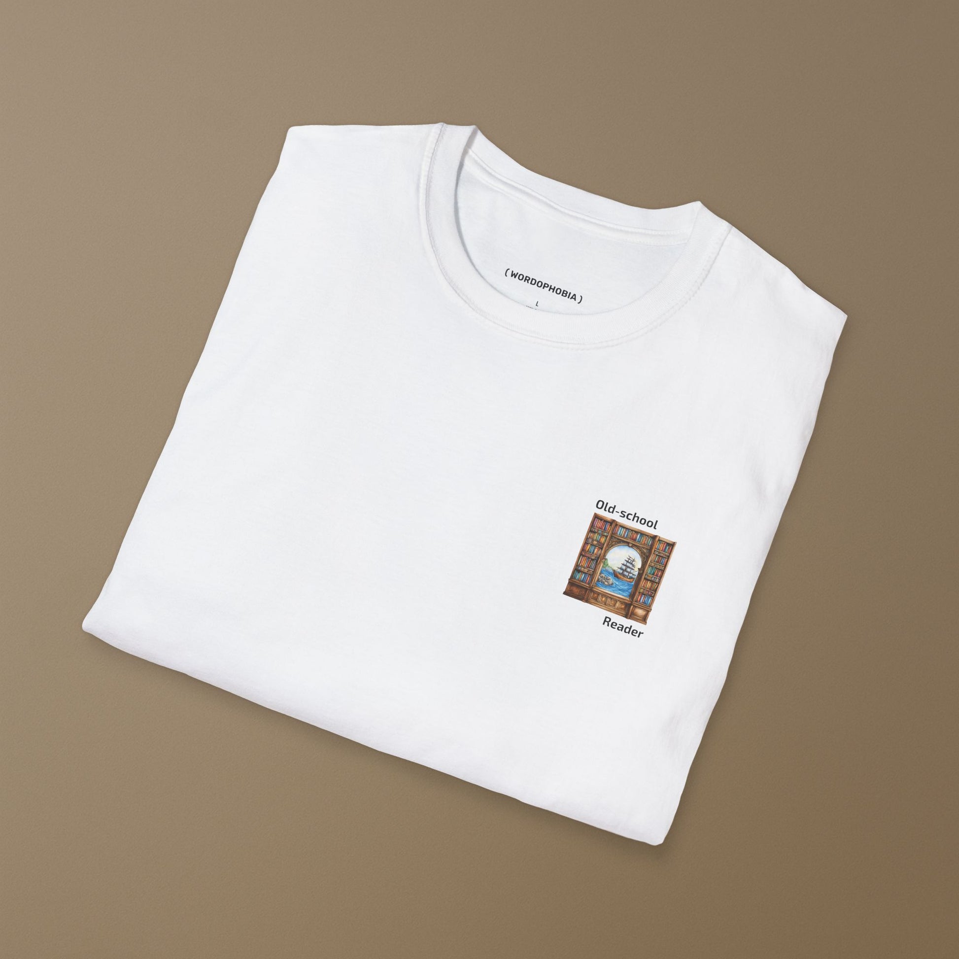 Folded white t-shirt with a small graphic and text "Old-school reader" on a brown background