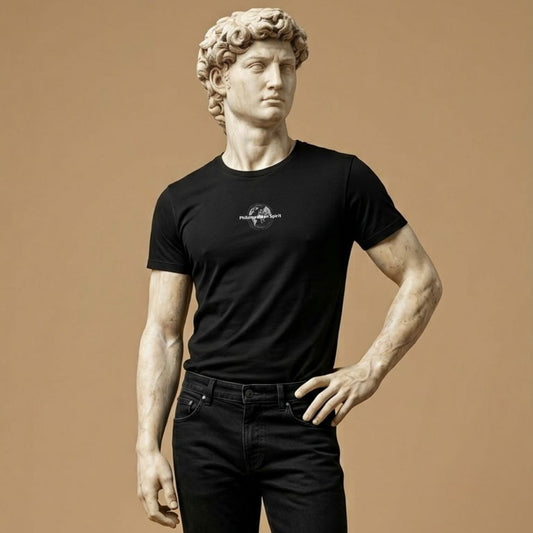 Statue wearing a black t-shirt with a design of the phrase “Philomathean Spirit,” and expressing curiosity and love of learning, on a brown background