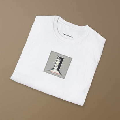 Folded white t-shirt with the German word “Schwellenangst,” meaning fear before a new beginning on a beige background