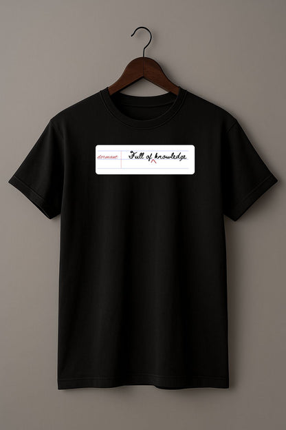 Black t-shirt with a white notebook page with 'dormant'  and 'Full of knowledge' on a hanger against a gray background