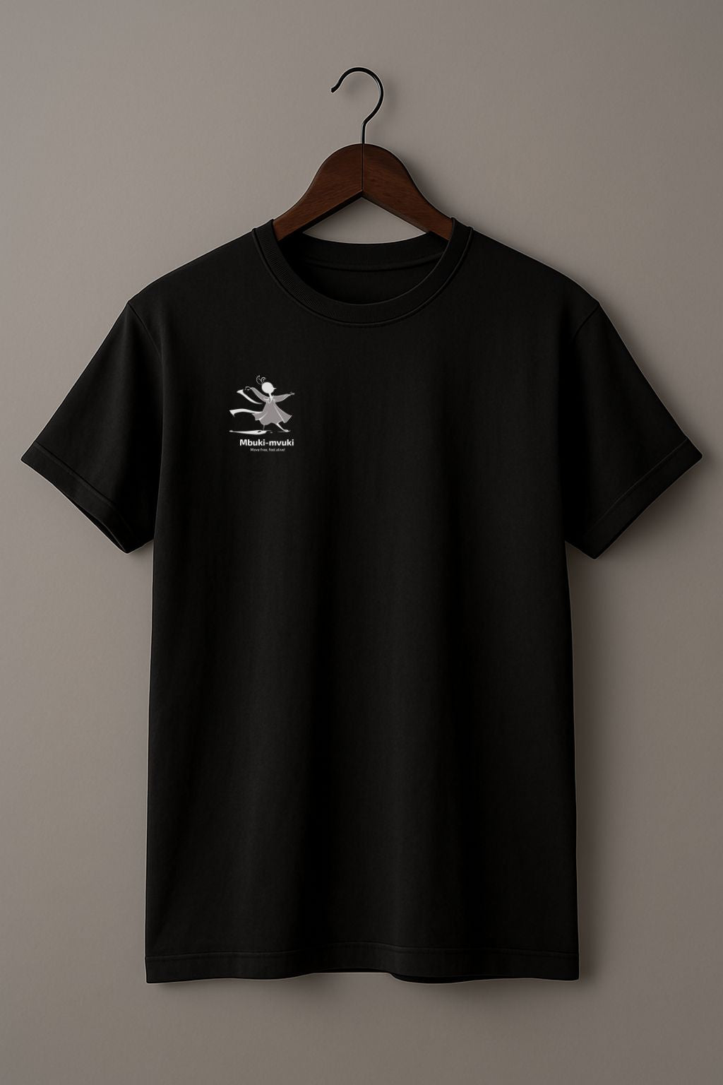 Black t-shirt with the African word Mbuki-mvuki and a tiny fantasy dancing mascot graphic on a hanger against a beige background